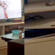 An upside-down PlayStation 5 in an entertainment center with a zoomed in look at the console superimposed.